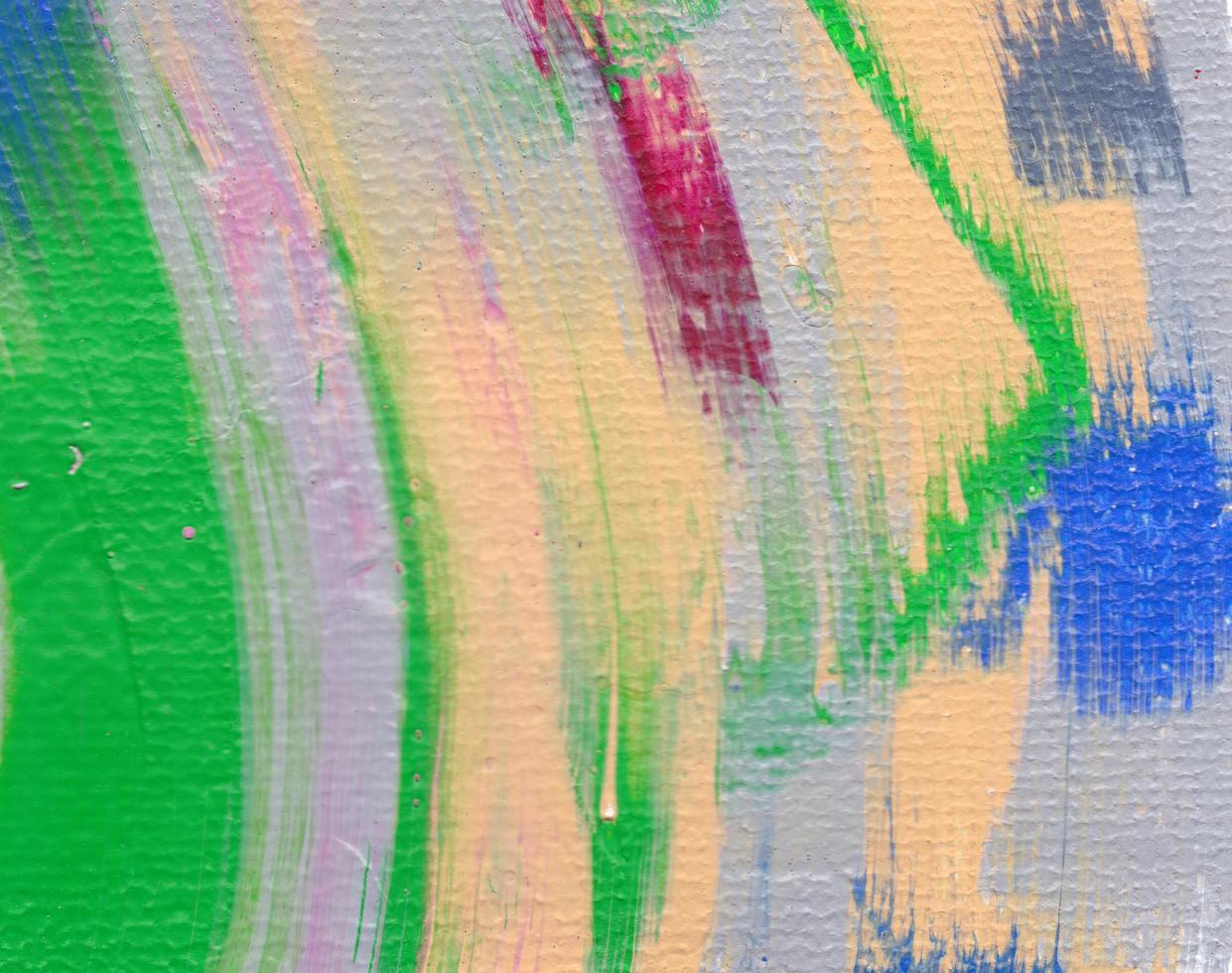 Artist's palette with mixed oil paints, macro, colorful stroke texture on canvas, abstract art background photo