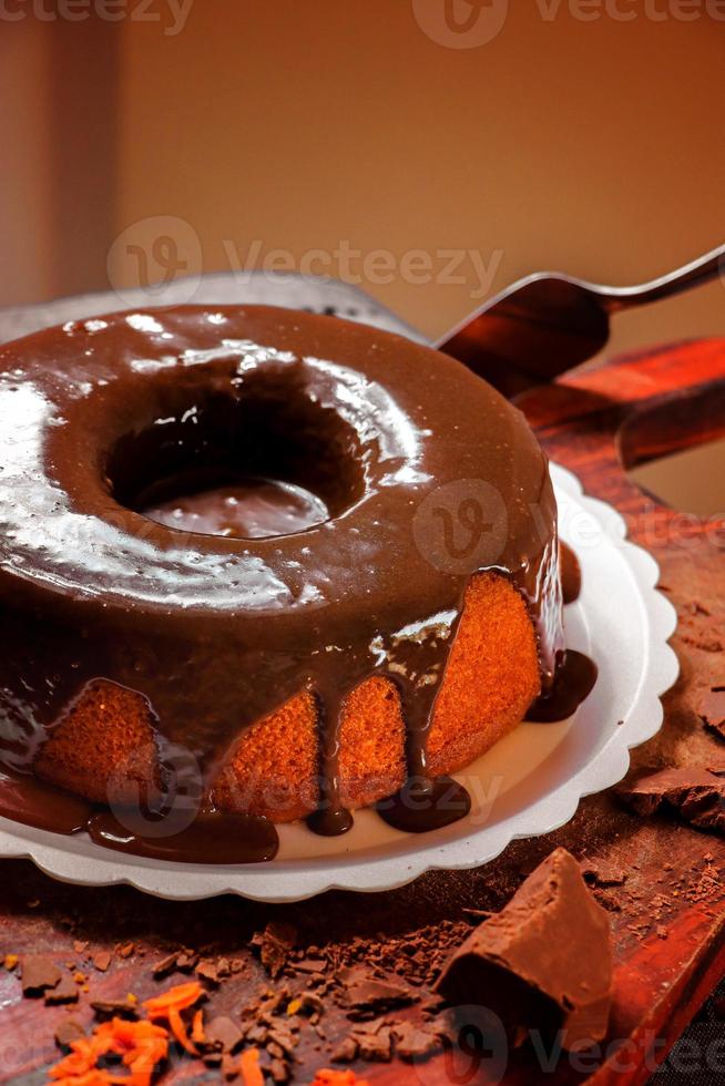 Carrot cake with chocolate icing photo