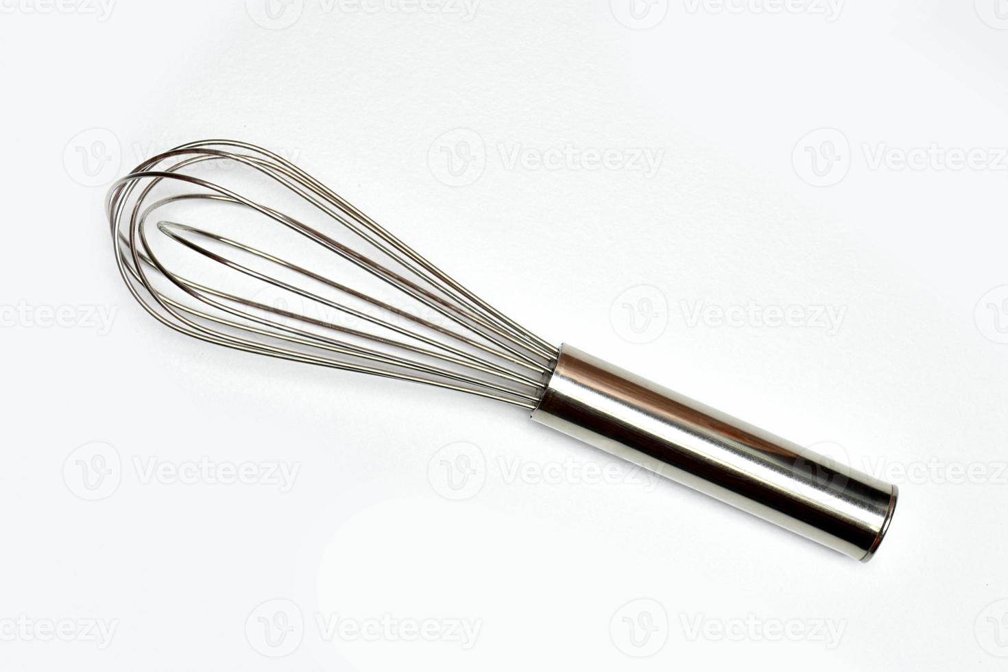 Top view of Whisk isolated on white background view. Kitchen equipment. Close up view. Hobby cooking. photo