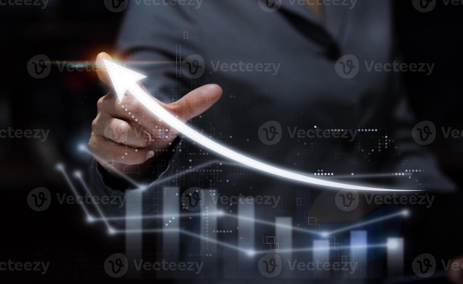 business woman holding hand and finger to top of graph photo