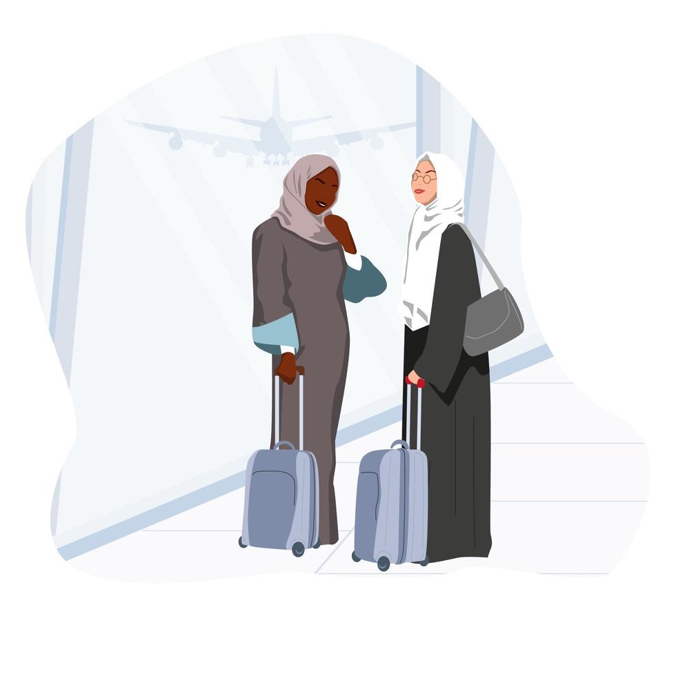 Two Muslim business ladies at the airport vector