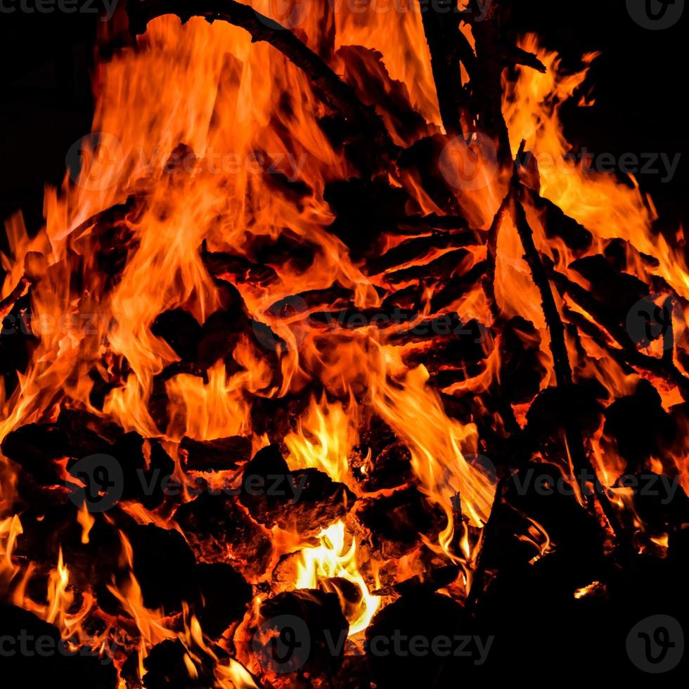 Fire flames on black background, Blaze fire flame texture background, Beautifully, the fire is burning, Fire flames with wood and cow dung bonfire photo