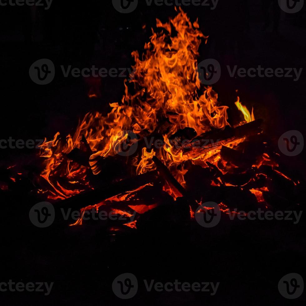 Fire flames on black background, Blaze fire flame texture background, Beautifully, the fire is burning, Fire flames with wood and cow dung bonfire photo