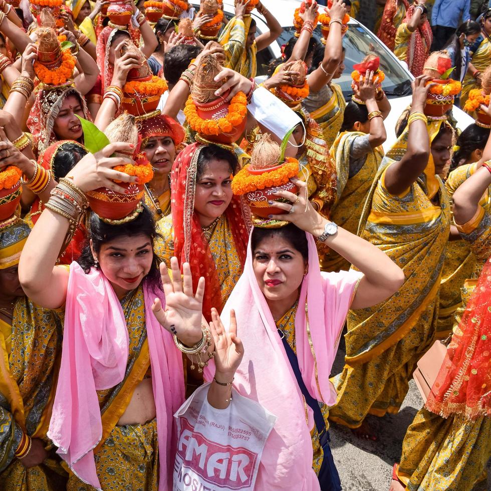 New Delhi, India April 03 2022 - Women with Kalash on head photo