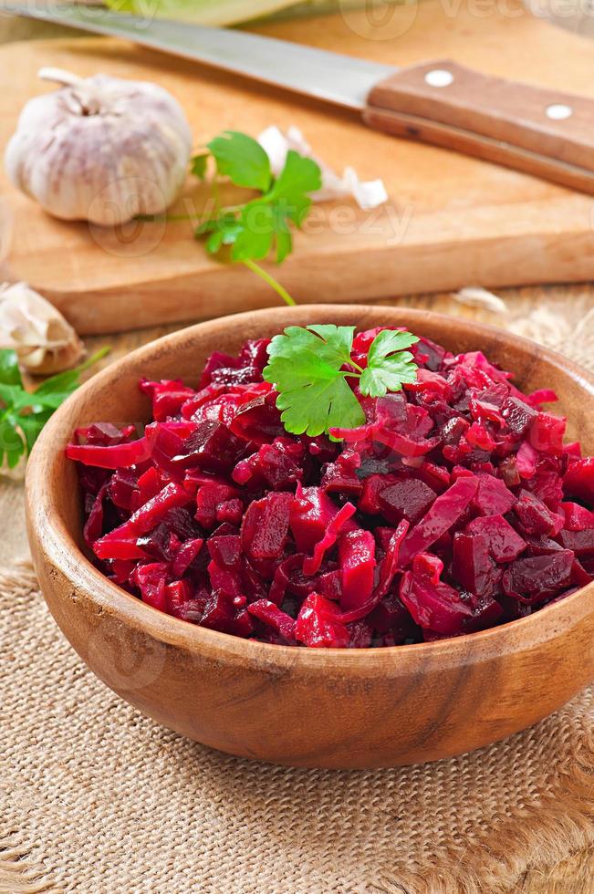 Beet salad Vinaigrette in a wooden bowl photo