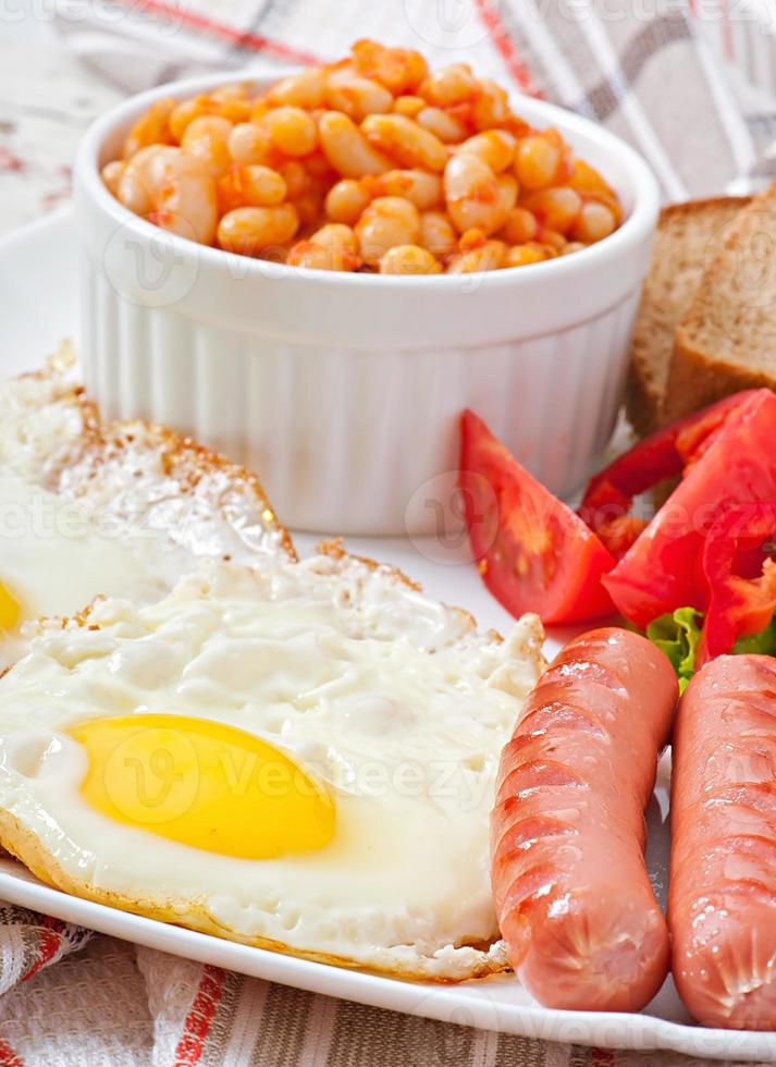 English breakfast - sausages, eggs, beans and salad photo