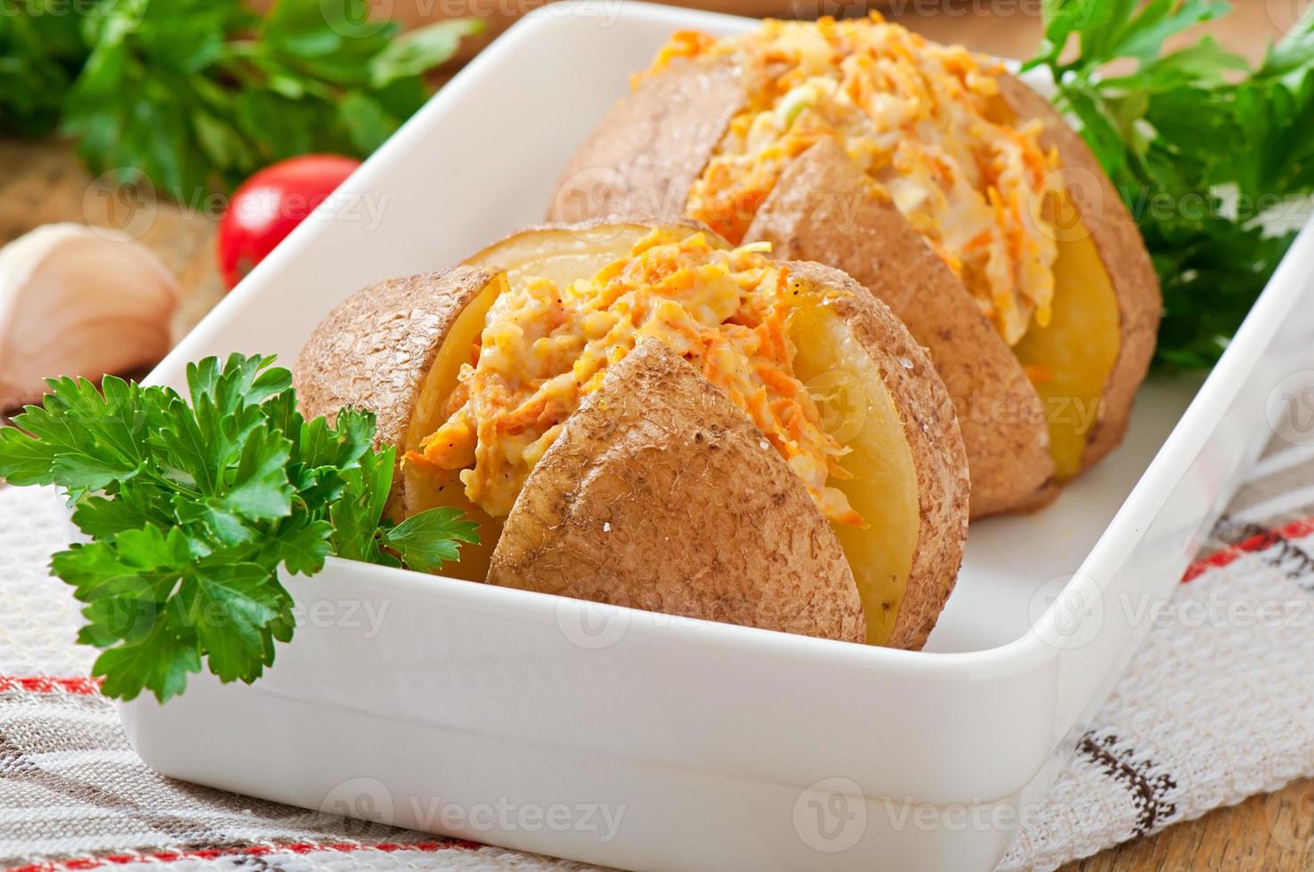 Baked potatoes stuffed with minced chicken and carrots photo