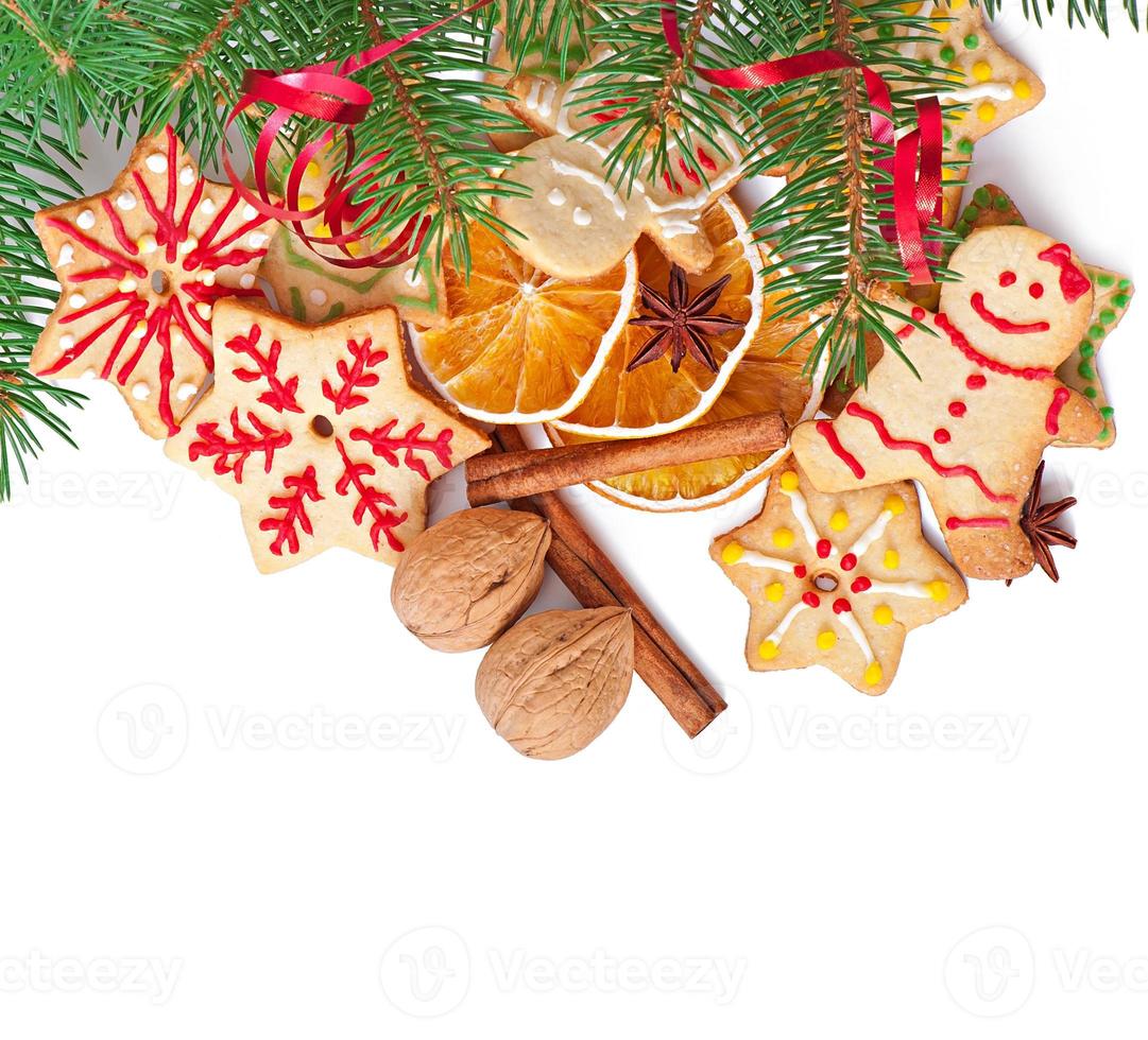 Christmas cookies, spices and spruce branches isolated on white background photo