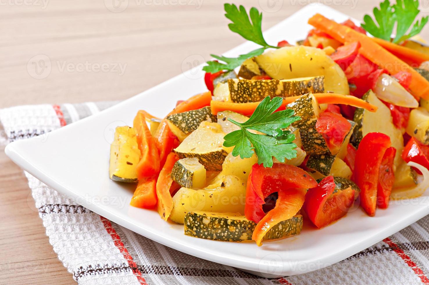 Roasted vegetables - zucchini, tomatoes, carrots, onions and paprika photo