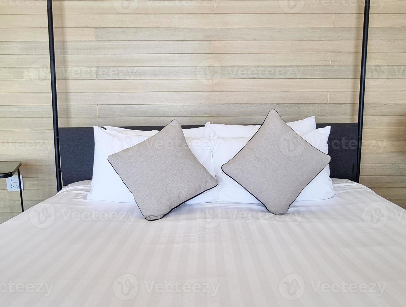 white bedsheet prepare on bed room. with pillow. clean interior comfort service room in spa and hotel photo