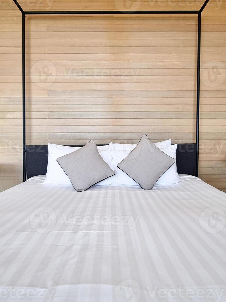 white bedsheet prepare on bed room. with pillow. clean interior comfort service room in spa and hotel photo
