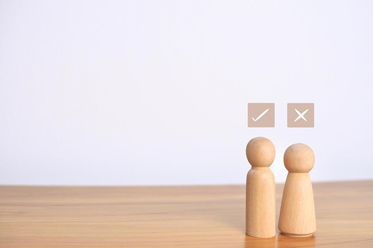 couple wooden doll toy standing together on background, new married life living insurance concept. photo