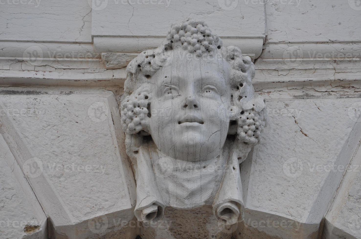 Ancient mask in Venice, Italy photo