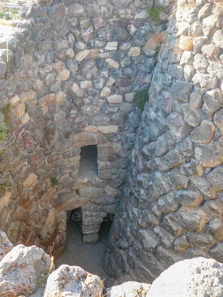 Ruins of ancient Sunuxi Nuraghe megalithic building in Sardinia, photo