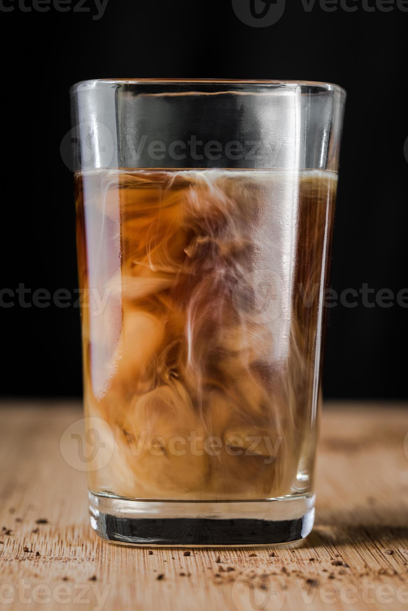 Adding Cream to Coffee 7329518 Stock Photo at Vecteezy