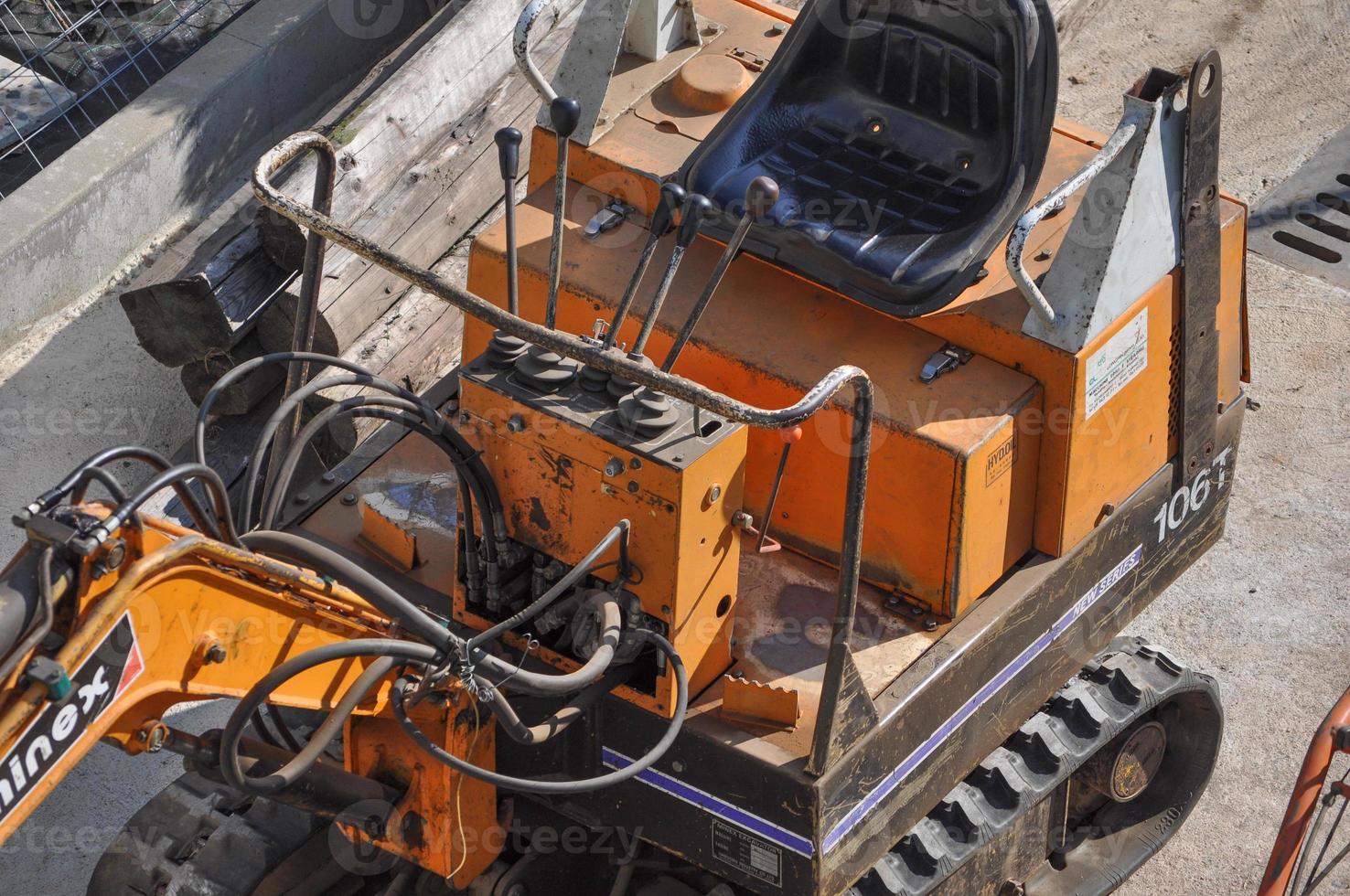 Excavator machine in construction site photo