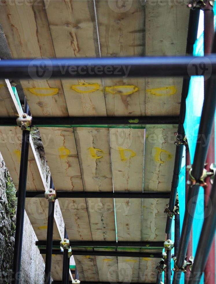Temporary scaffold for construction works at building site photo