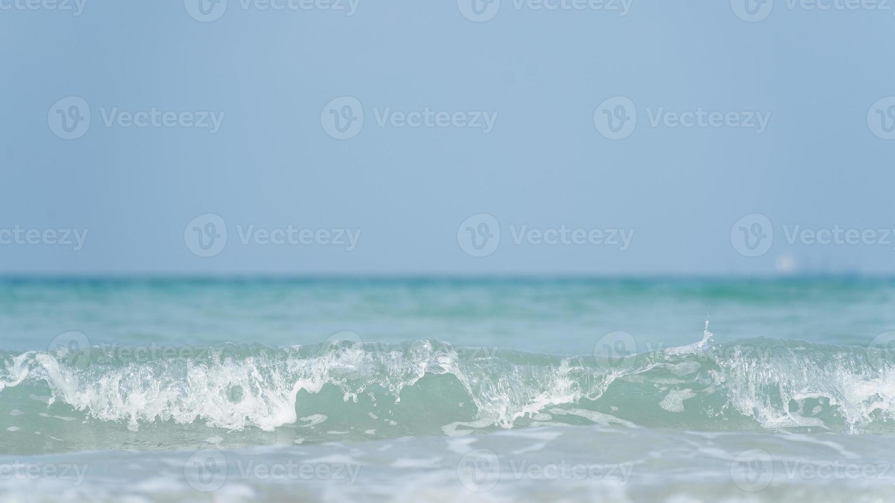 Sea waves on the beach island in the morning. The sea in the morning, the weather is bright, the sunlight has beautiful waves on the island. photo