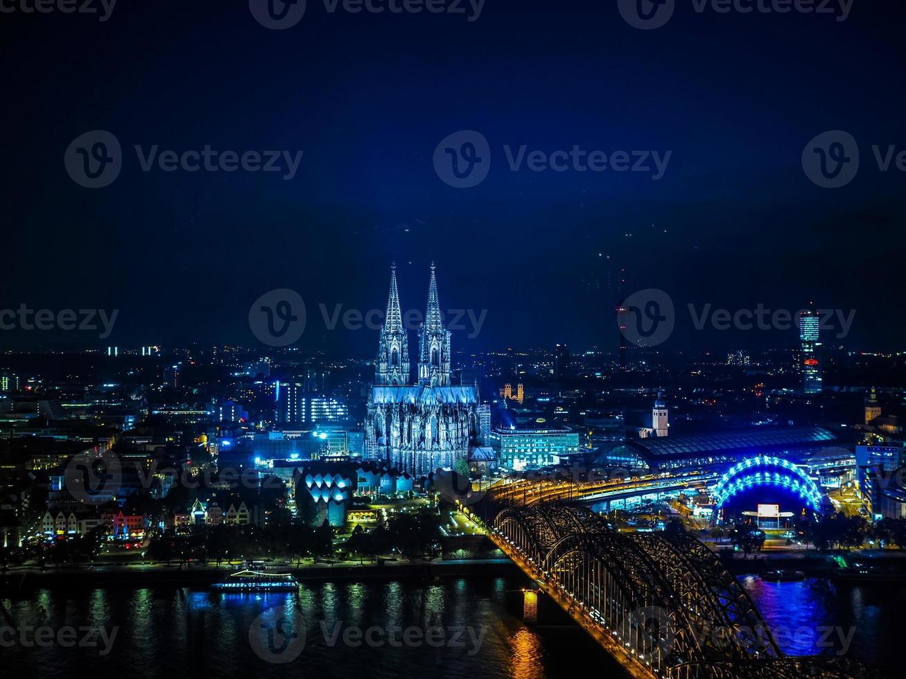 HDR Aerial night view of St Peter Cathedral and Hohenzollern Bri photo