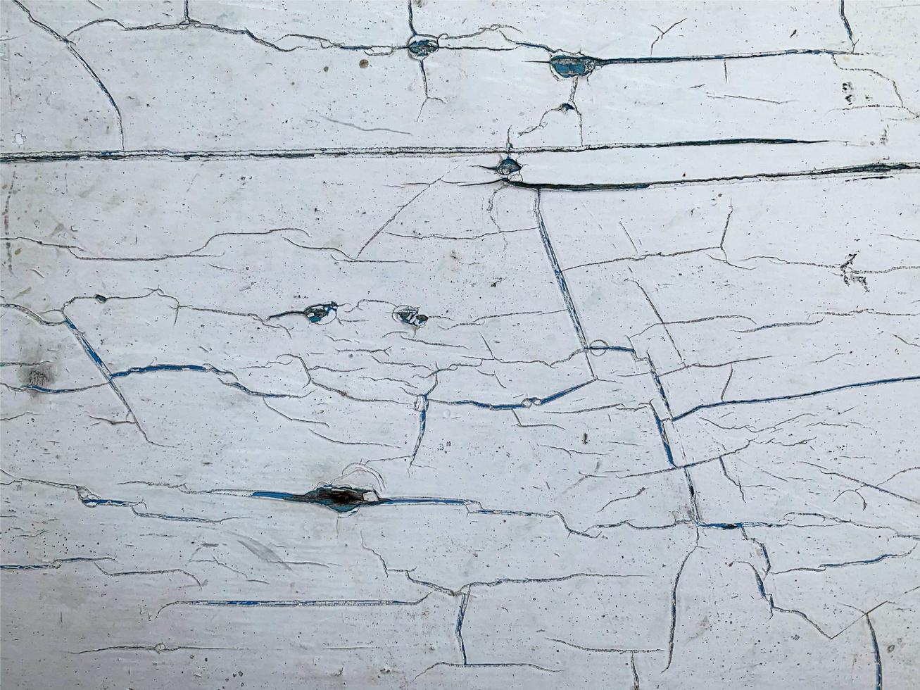 Wooden wall with weathered paint texture photo