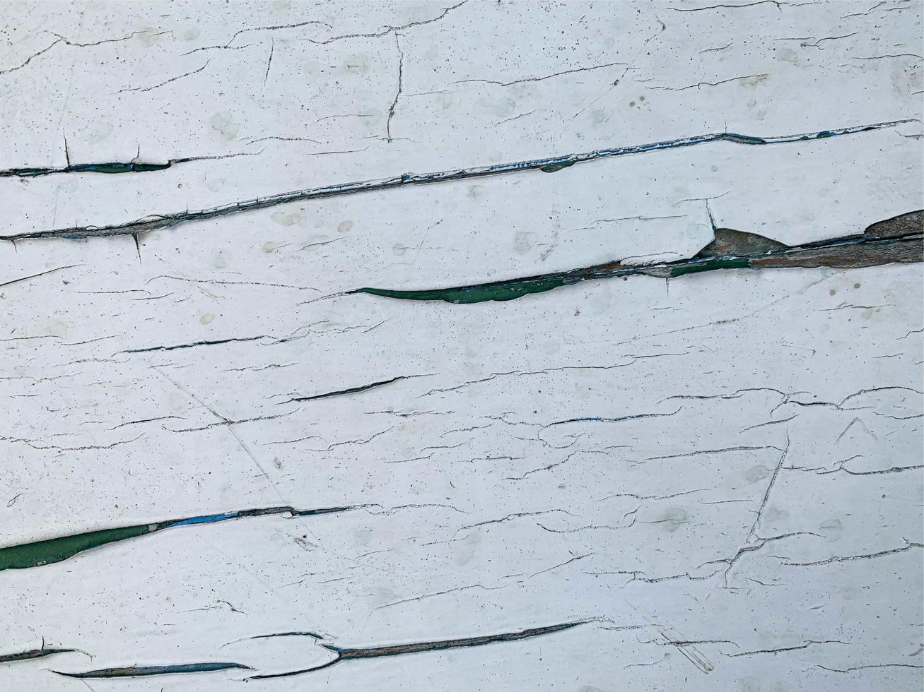 Wooden wall with weathered paint texture photo