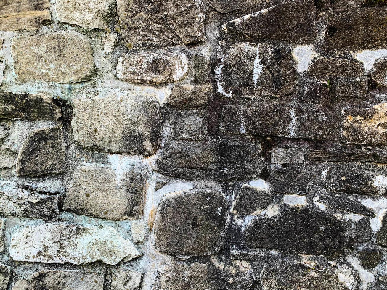 antiguo fondo de pared de piedra. telón de fondo de piedra foto