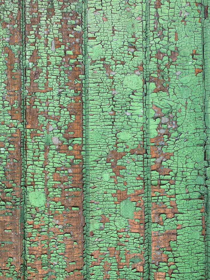 Wooden wall with weathered paint texture photo