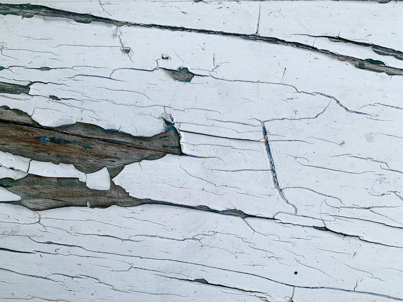 Wooden wall with weathered paint texture photo