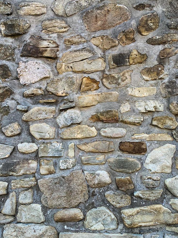 antiguo fondo de pared de piedra. telón de fondo de piedra foto