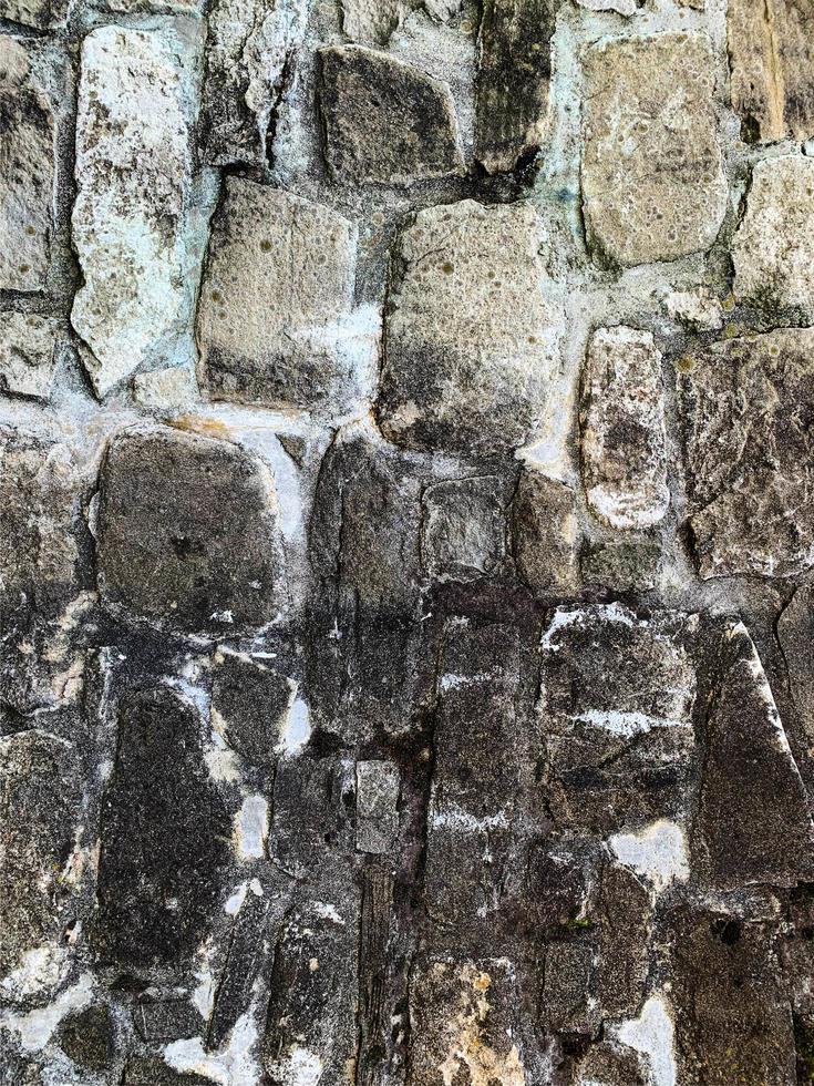 antiguo fondo de pared de piedra. telón de fondo de piedra foto