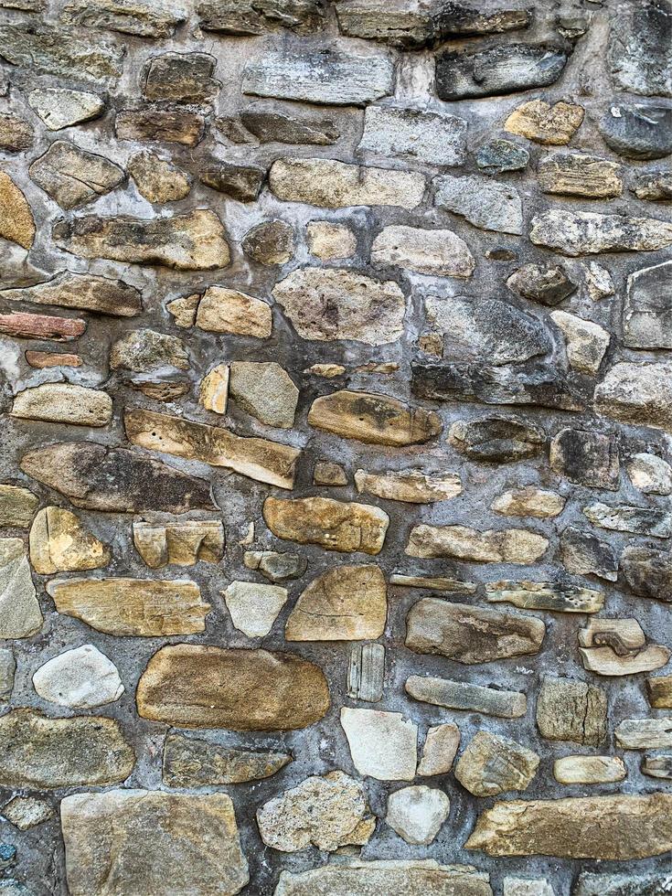 antiguo fondo de pared de piedra. telón de fondo de piedra foto