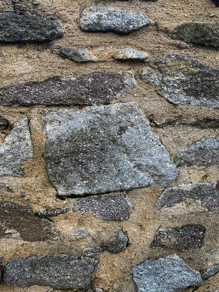 Old stone wall background. Stone backdrop photo