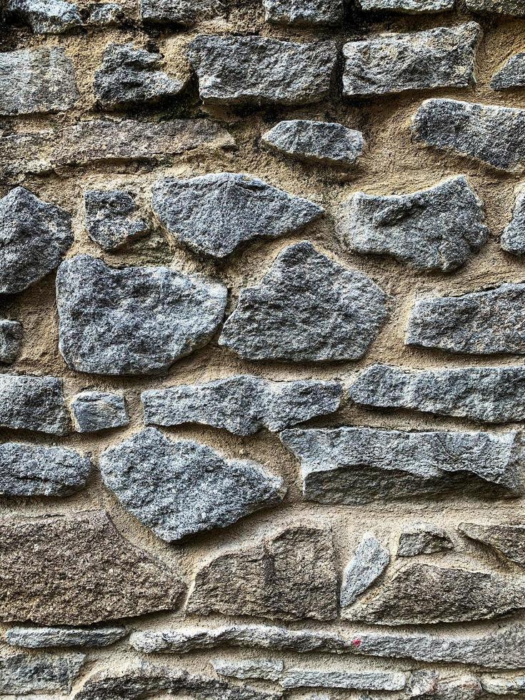 Old stone wall background. Stone backdrop photo