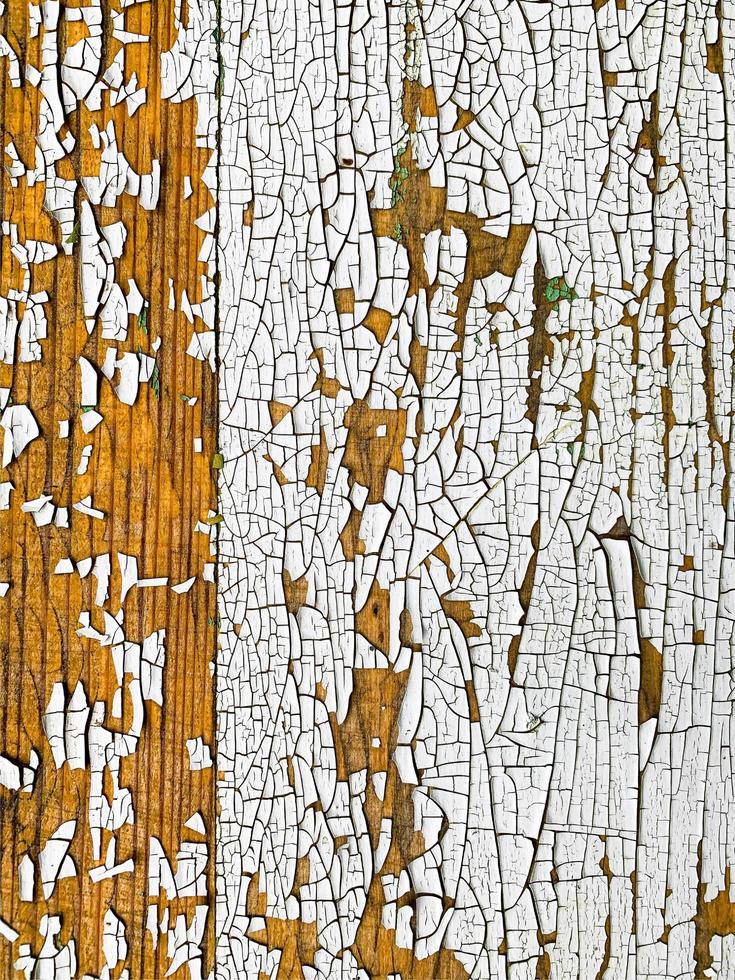 Wooden wall with weathered paint texture photo