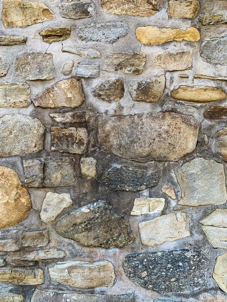 antiguo fondo de pared de piedra. telón de fondo de piedra foto