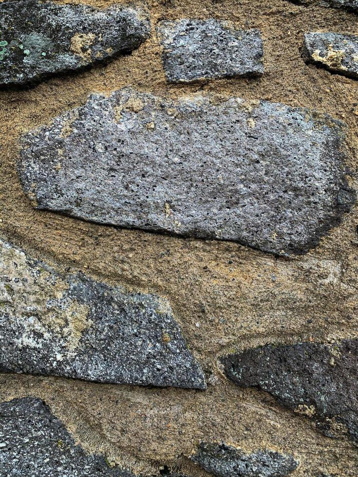 antiguo fondo de pared de piedra. telón de fondo de piedra foto