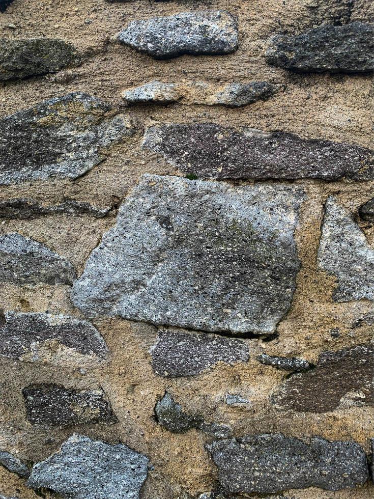 antiguo fondo de pared de piedra. telón de fondo de piedra foto