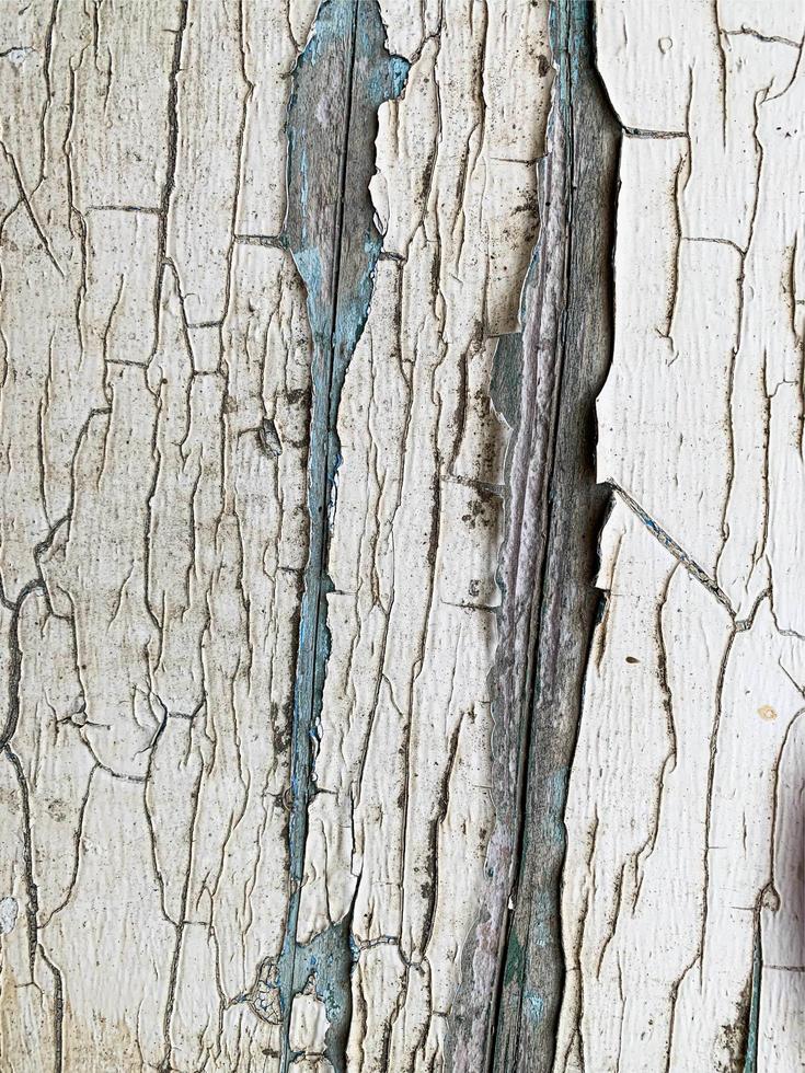 Wooden wall with weathered paint texture photo