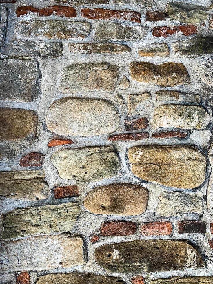 antiguo fondo de pared de piedra. telón de fondo de piedra foto