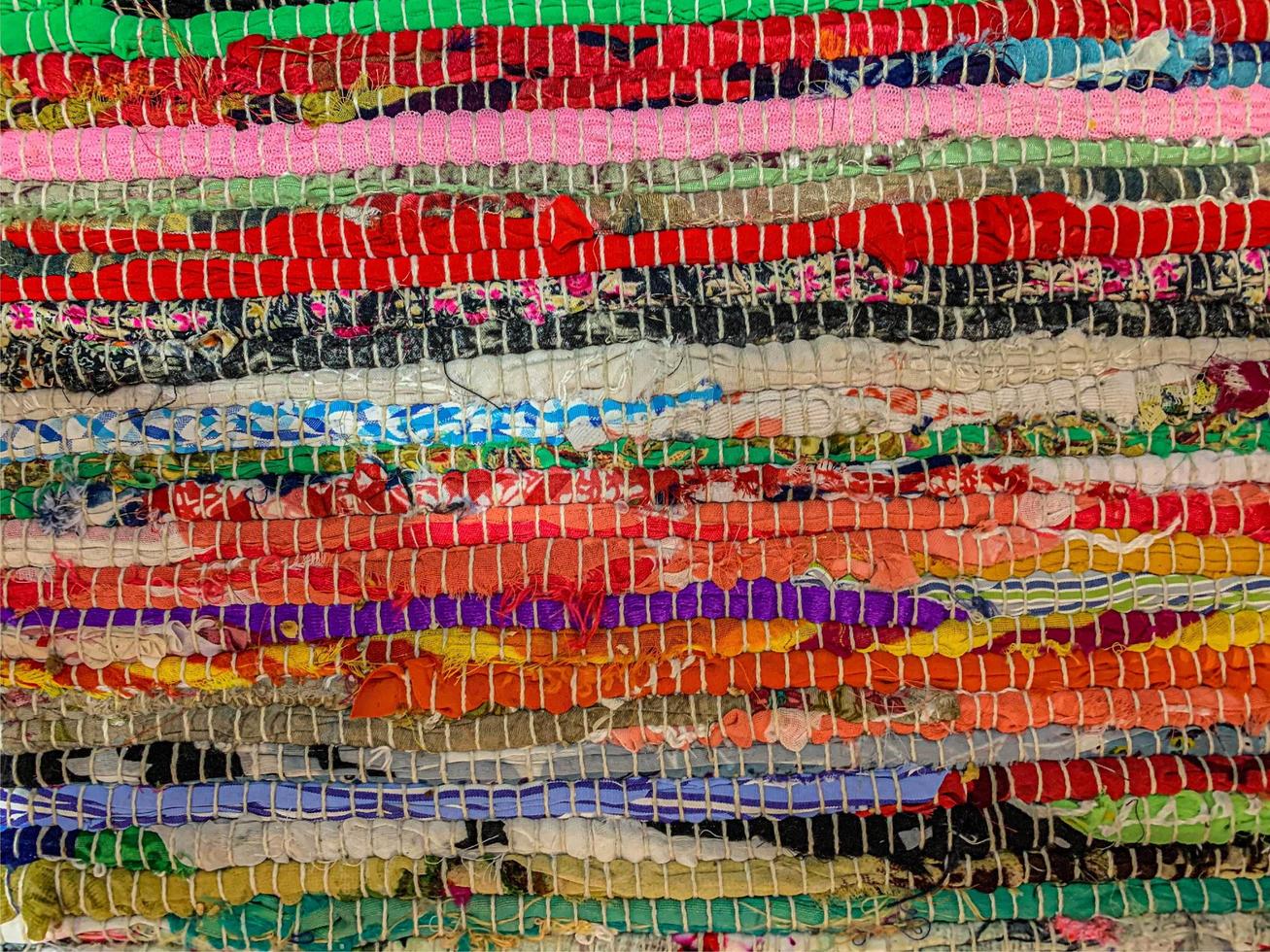 Colored textile carpet background. Carpet texture photo