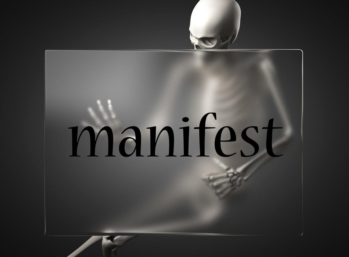 manifest word on glass and skeleton photo