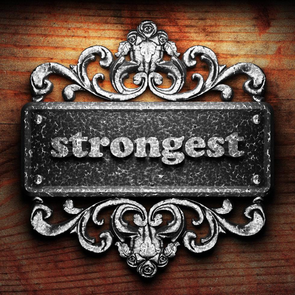 strongest word of iron on wooden background photo
