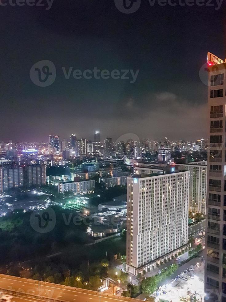 City panorama Bangkok by night. Skyscraper cityscape capital of Thailand. photo