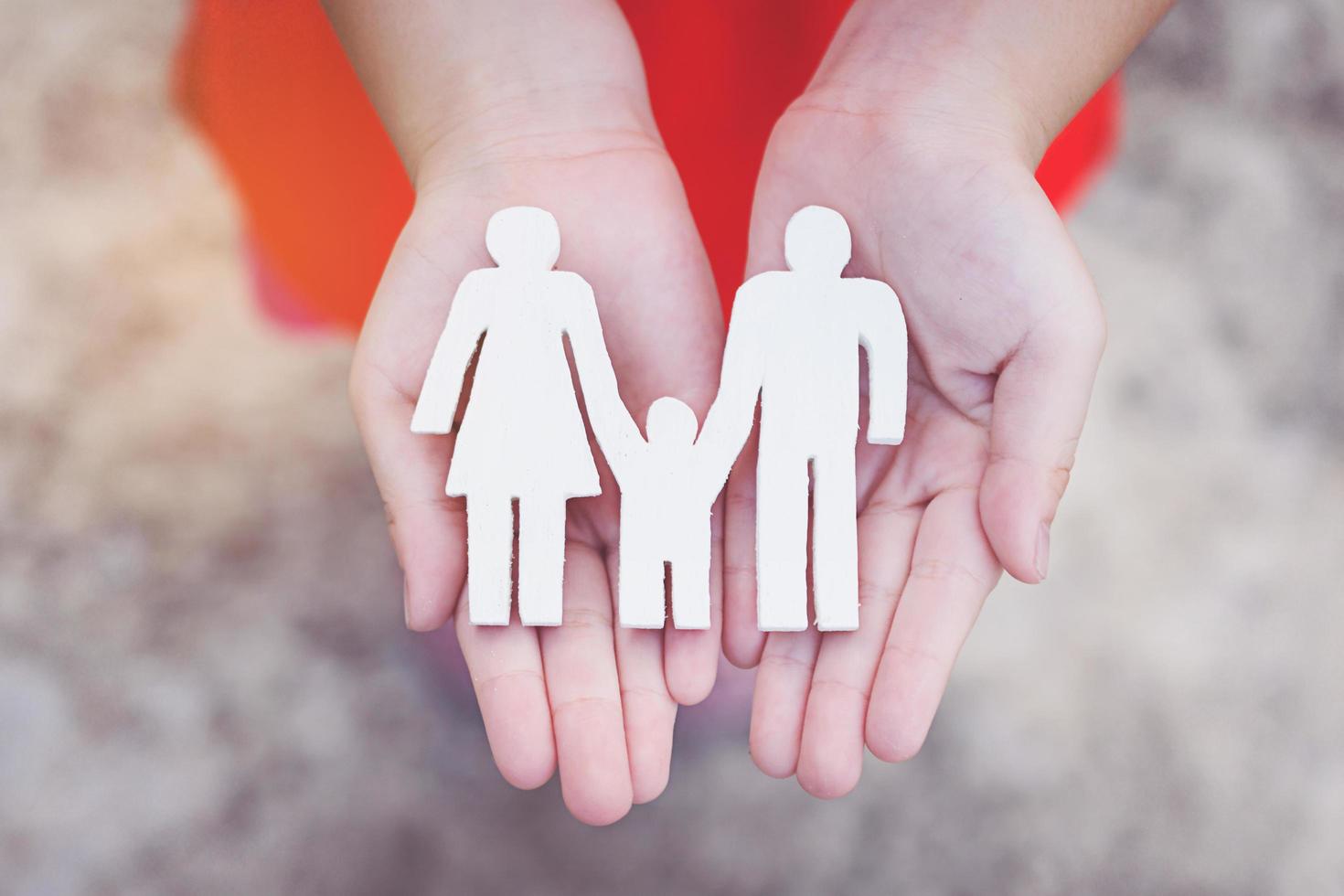 Children hands holding small model family , concept family photo