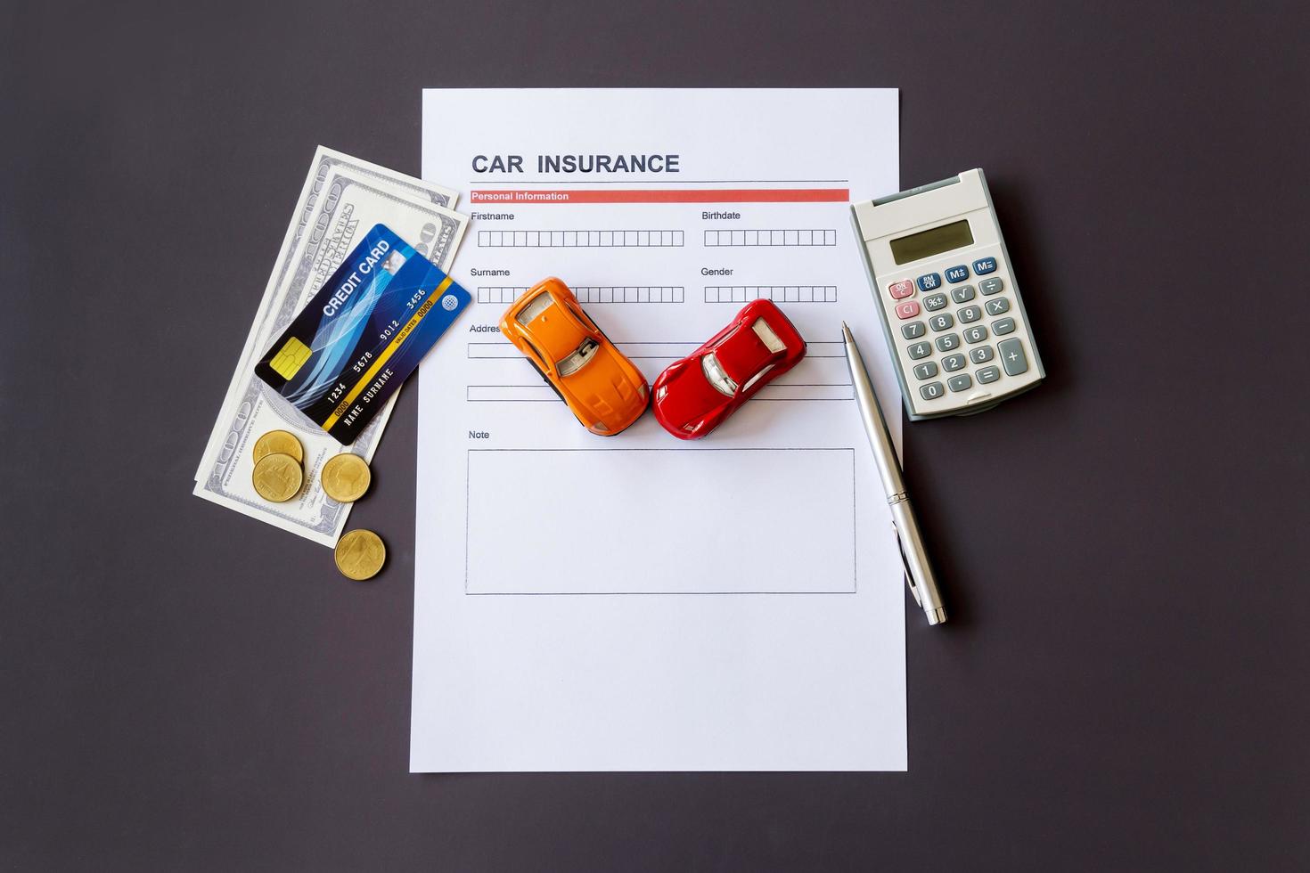 Car insurance form with model and policy document photo