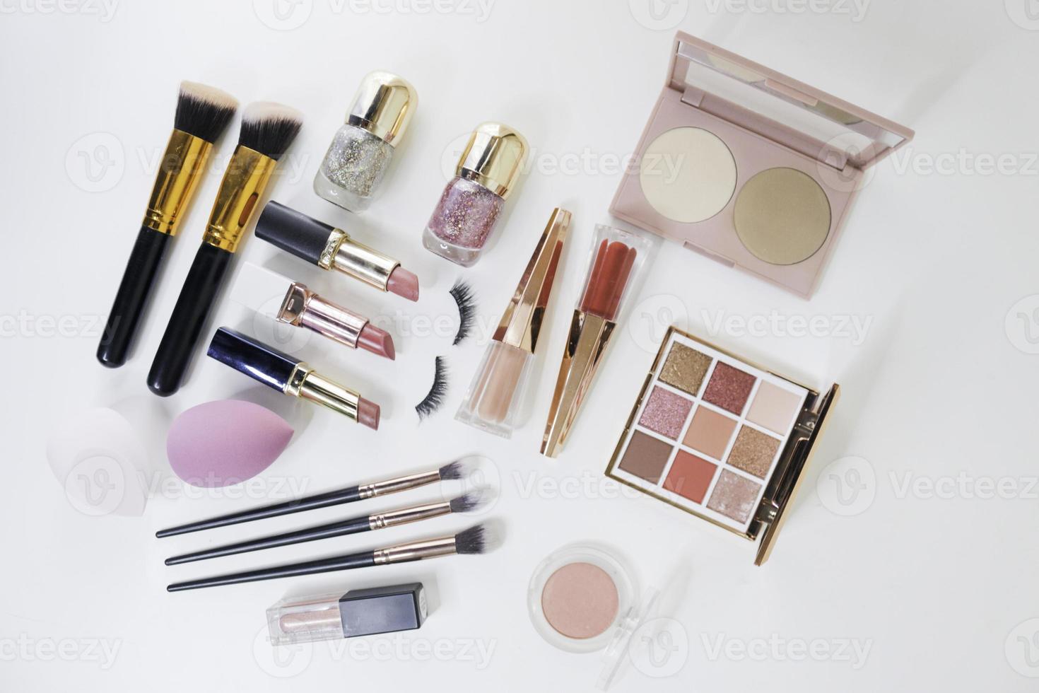 Makeup brush and decorative cosmetics on a white background. photo