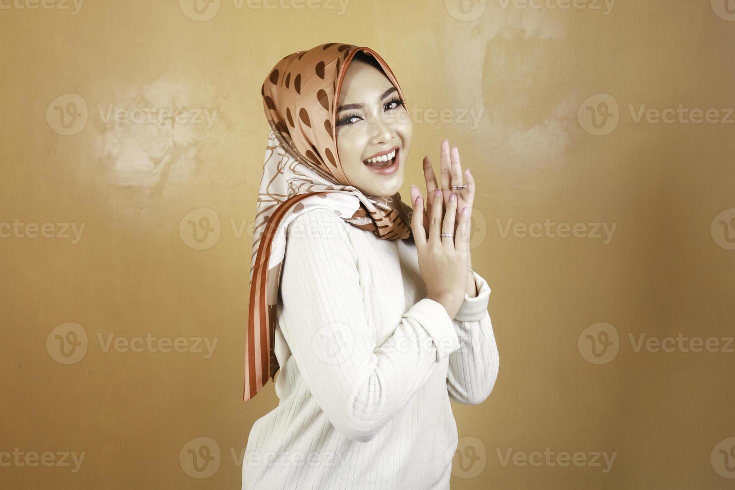 Cheerful young beautiful Asian Muslim woman smiling. photo