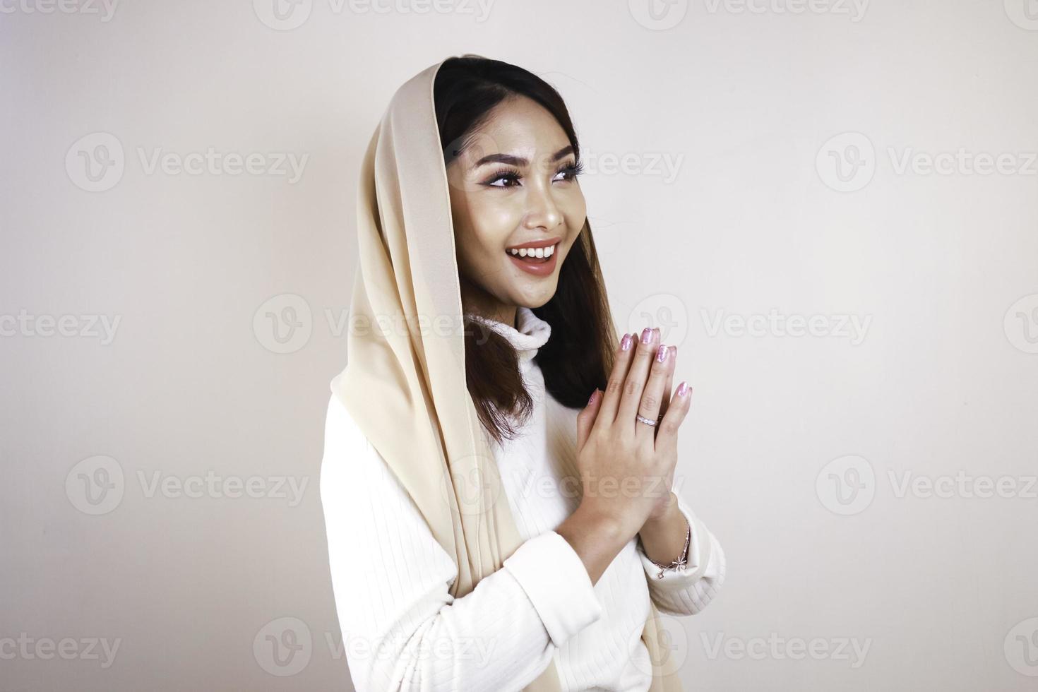 Portrait young beautiful Muslim woman wearing a hijab. Eid Mubarak greeting photo