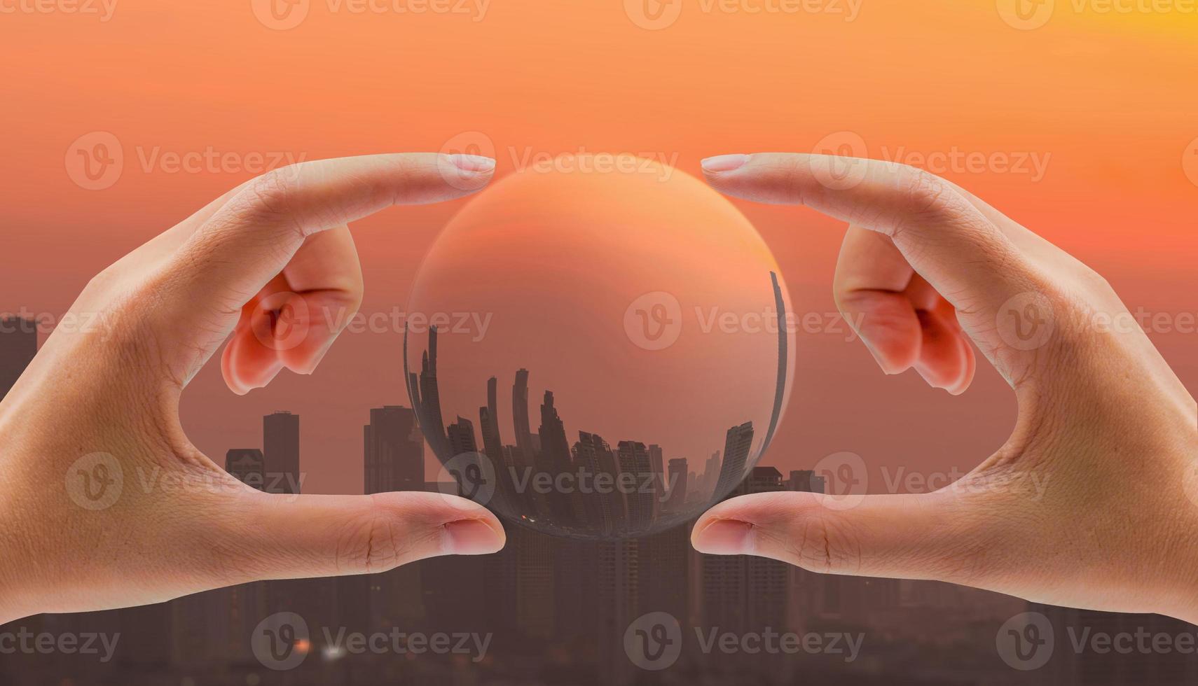 Human hand holding building in the city with air pollution. Carbon capture technology concept. Smog and fine dust covered city. Cityscape with CO2 emissions. Dirty environment. Urban toxic dust. photo
