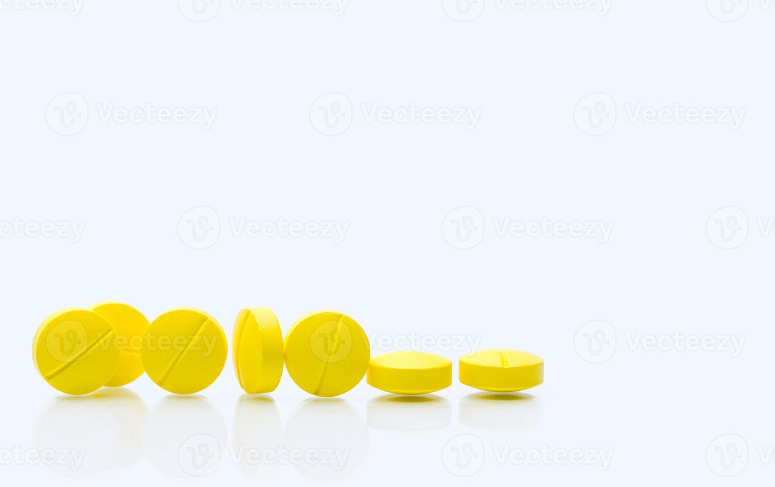 Yellow tablets pills on white background. Prescription drugs. Pharmaceutical industry. Healthcare and medicine. Pharmacy drugstore web banner. Tablets pills manufacturing industry. Healthcare industry photo